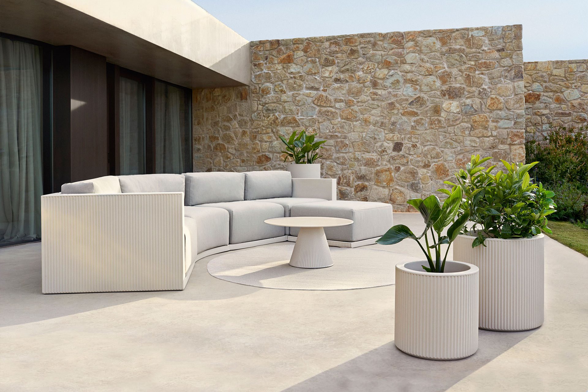 Gatsby modular sofa and planters by Vondom